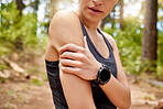Active woman holding her arm in pain while exercising outdoors. Closeup of a unrecognizable female athlete suffering with painful bicep injury, causing discomfort and strain. Muscle sprain from sore joints