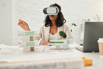 Young designer using AI simulator to plan building. African American architect using VR goggles.Young engineer using a virtual reality headset in her office. Businesswoman playing a fun game