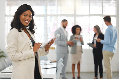 Buy stock photo Portrait of a happy african american businesswoman working on a digital tablet in an office. One black female boss smiling and holding a digital tablet while in a meeting at work