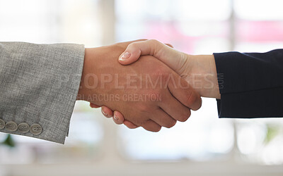 Buy stock photo Two businesspeople shaking hands while in an office together at work. Business professionals greeting networking and making deals with each other. Boss hiring an employee