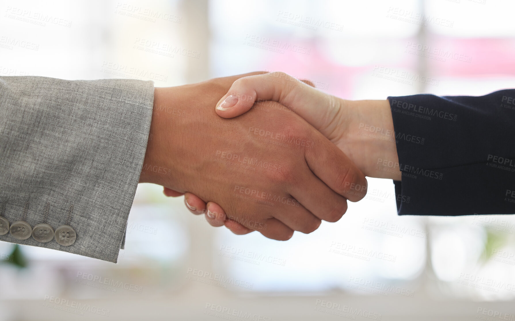 Buy stock photo Two businesspeople shaking hands while in an office together at work. Business professionals greeting networking and making deals with each other. Boss hiring an employee