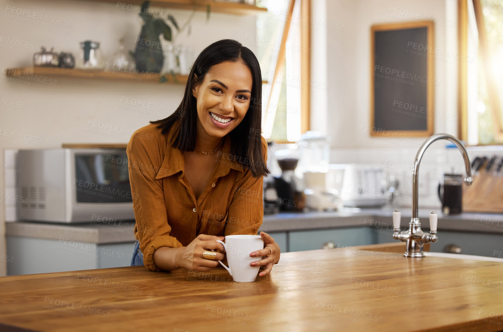 Buy stock photo Happy portrait, coffee and woman at house in a kitchen with a hot drink feeling relax and calm in the morning. Happiness, zen and young female smile in a home with a mug in a household with tea