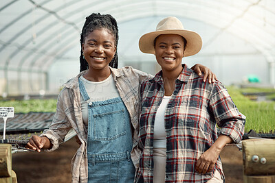 Buy stock photo Portrait of two farm workers. Happy coworkers embracing in their garden. Smiling colleagues standing in their garden together. african american farmers in agriculture. Colleagues in their greenhouse.....