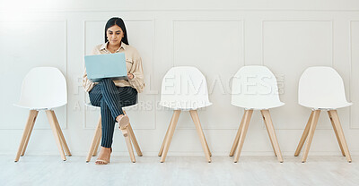 Buy stock photo Waiting room, sitting and a woman with a laptop for business, email and interview research. Office, working and corporate employee with a computer for the internet, recruitment planning and browsing