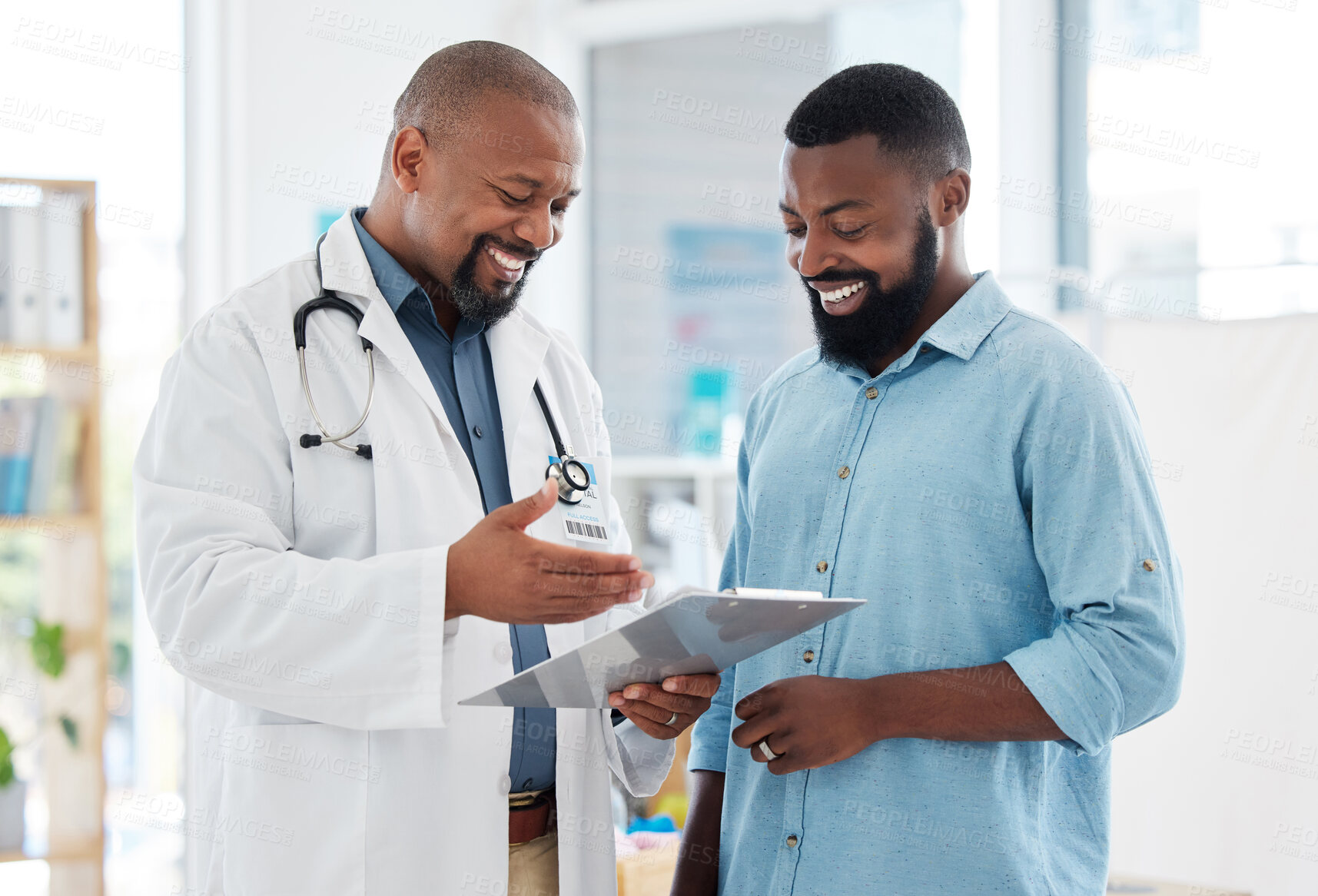 Buy stock photo Healthcare, black man and doctor with clipboard, diagnosis and conversation for results, smile and care. Male patient, guy and medical professional with documents, paperwork for insurance and talking