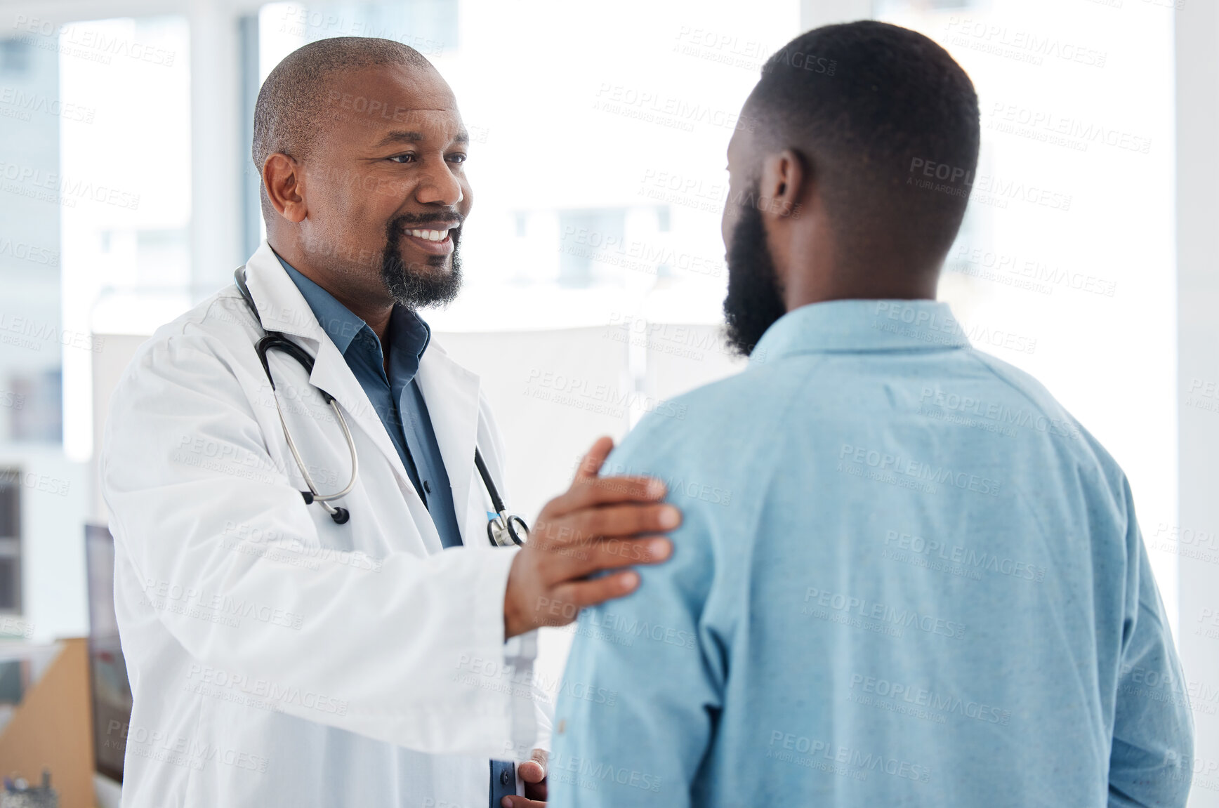 Buy stock photo Doctor, black man and touch shoulder of patient for support, comfort and empathy in hospital. Healthcare, consultation and happy medical professional talking, good news or kindness with mature person