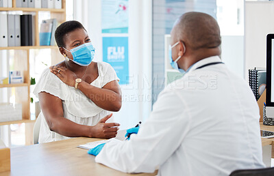 Buy stock photo Doctor, covid and patient with shoulder pain in hospital, fibromyalgia or inflammation. Face mask, healthcare professional and black woman with injury, arthritis or painful tendinitis in consultation