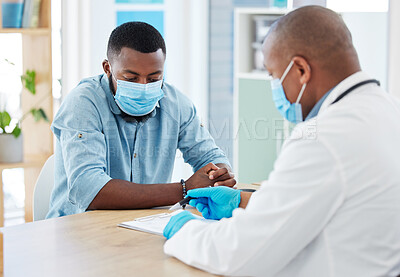 Buy stock photo Doctor, covid and black man in consultation for results on clipboard in hospital. Healthcare, face mask and medical professional with paperwork talking with patient for health diagnosis or checkup.