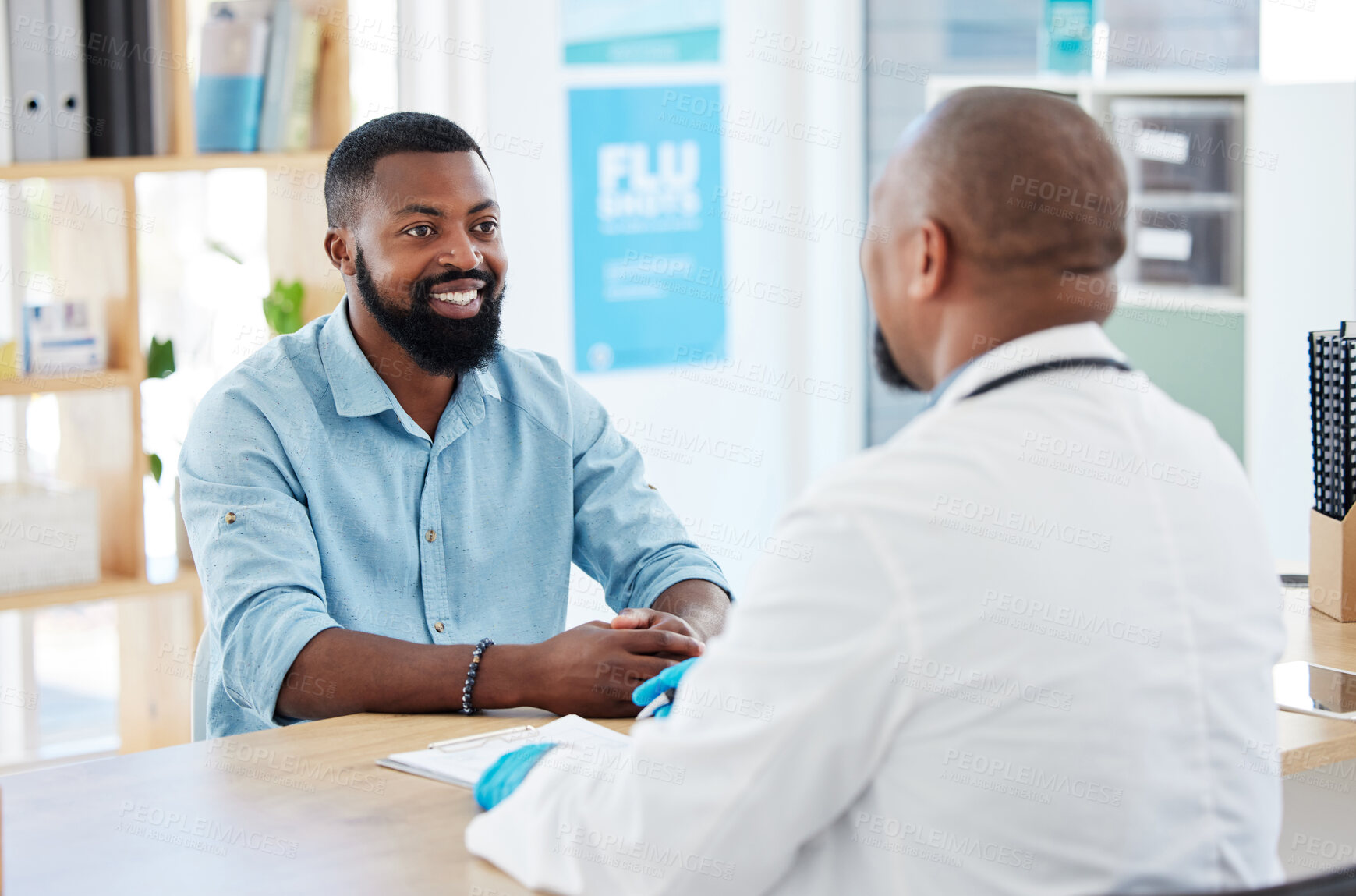Buy stock photo Doctor, black man and healthcare consultation with a wellness and hospital worker in a office. Consulting, patient and happy male with a smile from health communication and expert advice in a clinic