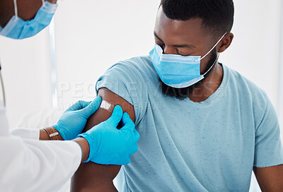 Buy stock photo Bandage, covid vaccine with doctor and patient in hospital, safety from virus with plaster and healthcare. People in medical consultation, immunization and black man in face mask and injection wound