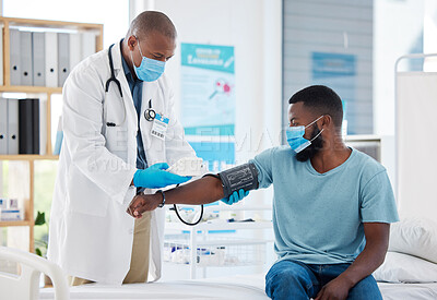 Buy stock photo Doctor, covid and blood pressure with black man patient for heart health, test or examination. Healthcare, hypertension and person, medical professional or sphygmomanometer for consultation in clinic