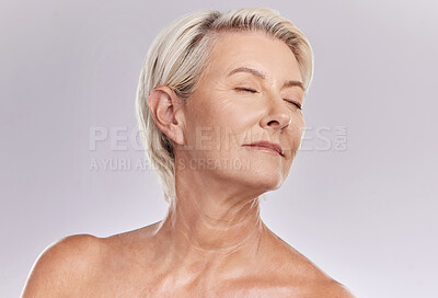 Buy stock photo Beauty, skincare and face of a senior woman posing with closed eyes and topless against grey studio background. Happy old, elderly or mature female with glowing skin due to cosmetic self care
