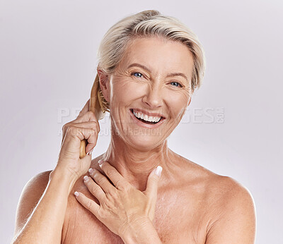 Buy stock photo Grooming, hygiene and hair care for a mature woman brush and style grey hair, smiling and happy. Portrait of a senior female enjoying selfcare and treatment, pamper session against pink background
