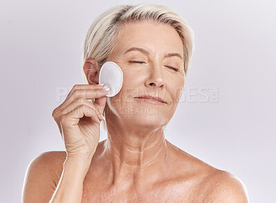 Buy stock photo Senior woman, beauty and eyes closed, cotton pad and natural cosmetics with antiaging skincare on white background. Clean makeup from face, wellness and skin, female model with glow and dermatology