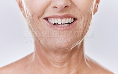Buy stock photo Senior woman with perfect white teeth, dental or Invisalign results and happy mouth closeup in studio. Mature model with a smile for good dentistry health insurance or excellent oral hygiene service