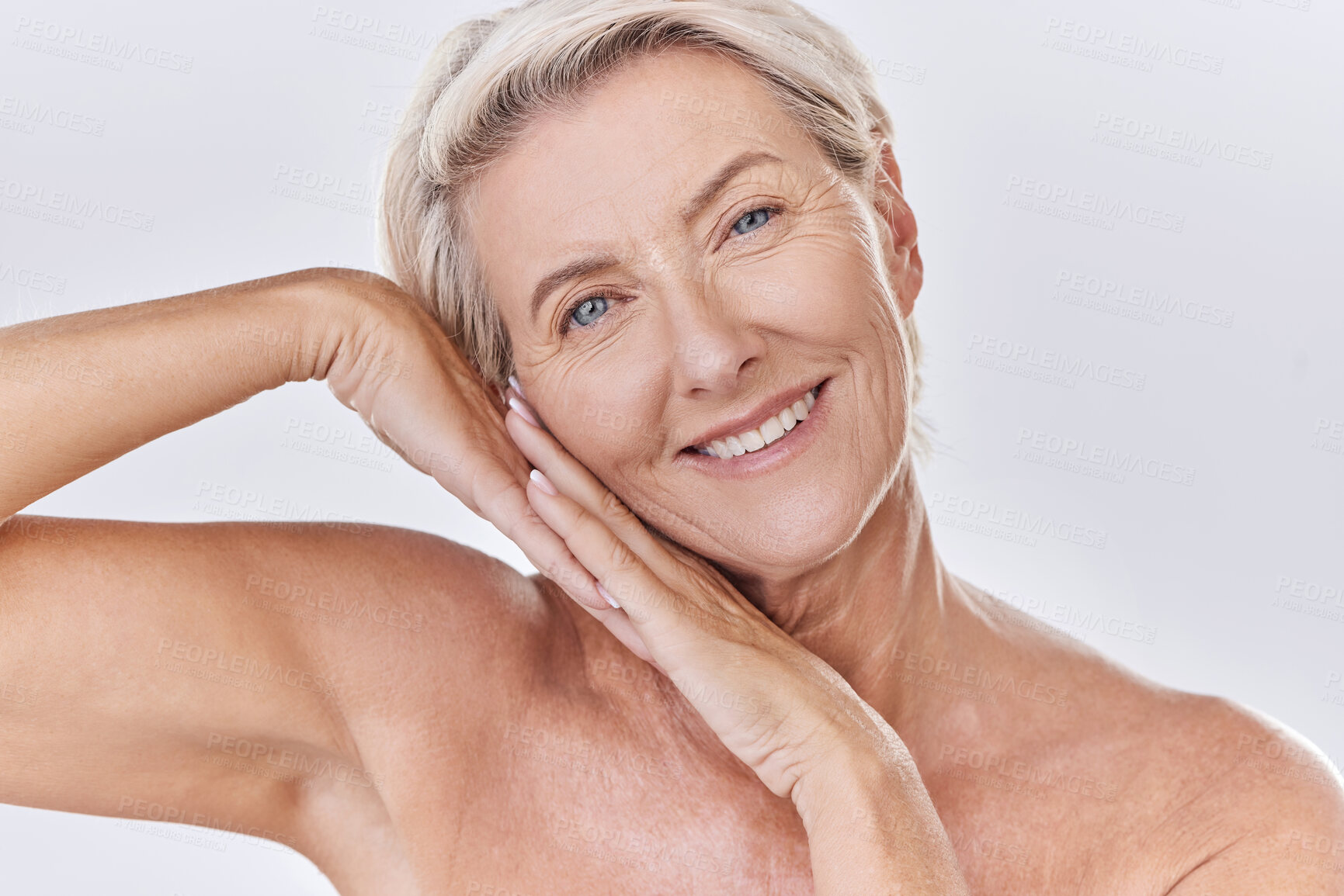 Buy stock photo Skincare, clean and happy senior woman face resting on hands in a studio portrait. Elderly beauty skin care model posing or showing bedtime routine for perfect, healthy looking or wrinkle free aging