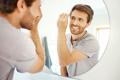 Buy stock photo Man, tweezer and eyebrow in bathroom mirror with smile, self care and hygiene to start morning in home bathroom. Young guy, person and tool for beauty, facial cosmetics and wellness for hair removal