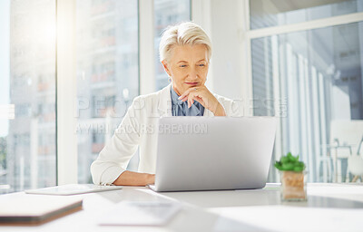 Buy stock photo Laptop, thinking and senior business woman in office inspired by research, idea and mission plan. Online, project and happy elderly female manager inspired while typing, browsing or planning proposal
