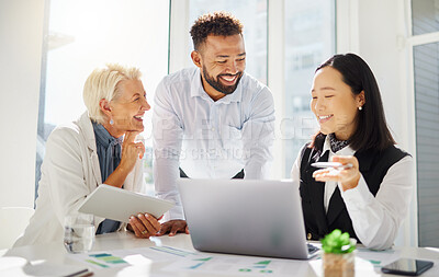 Group of happy diverse colleagues working together on corporate plans in an office boardroom. Mixed race businessman and caucasian businesswoman listening to asian colleague explaining ideas on a laptop