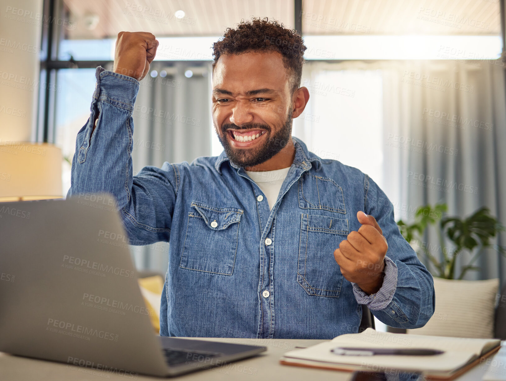 Buy stock photo Excited businessman cheering for his success. Cheerful entrepreneur cheering after reading an email on his laptop. Virtual remote businessman in luck after using his computer