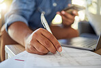 Closeup on hand of businessman filling in insurance form. hands of a businessman filling in banking documents for his budget. Freelance entrepreneur signing a contract to invest. Man signing paperwork