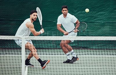 Buy stock photo Male team, ball and tennis court during a competition in india for fitness, health and sport. Man, athlete and together with action for game with training and a challenge for wellness in the outdoor.