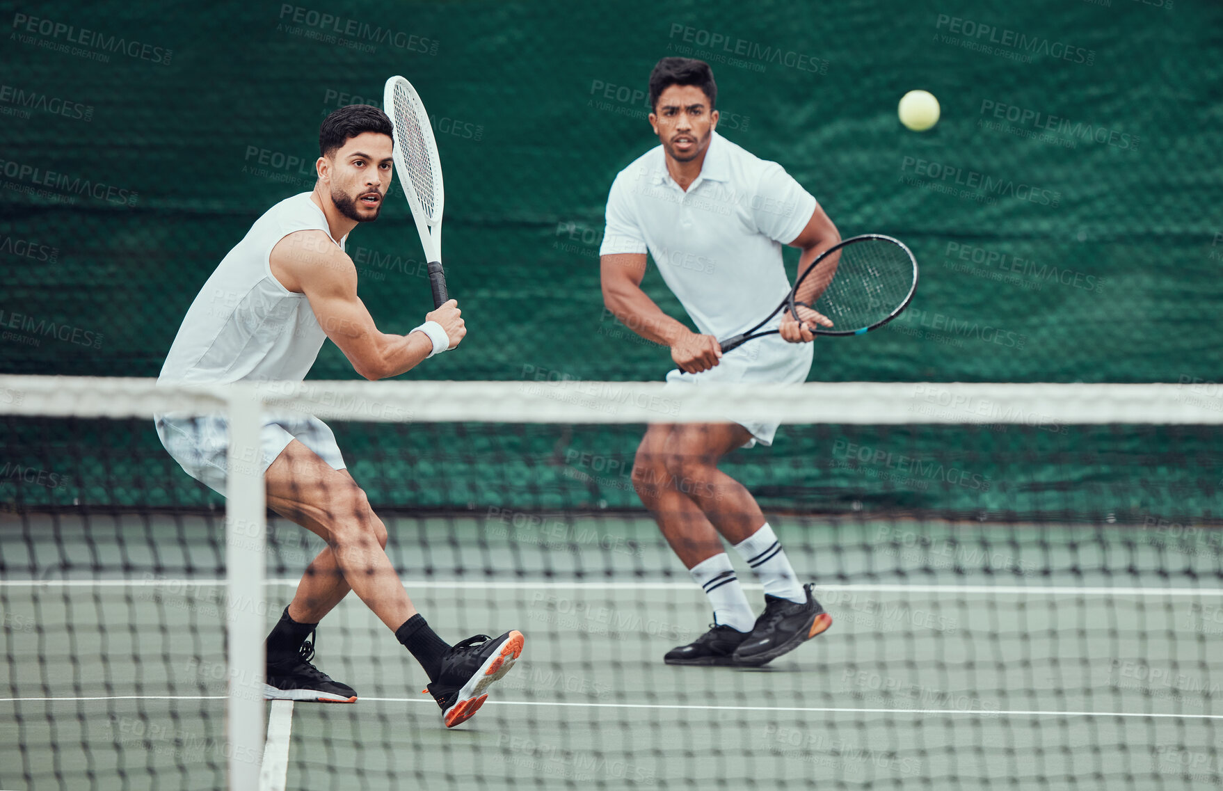 Buy stock photo Male team, ball and tennis court during a competition in india for fitness, health and sport. Man, athlete and together with action for game with training and a challenge for wellness in the outdoor.