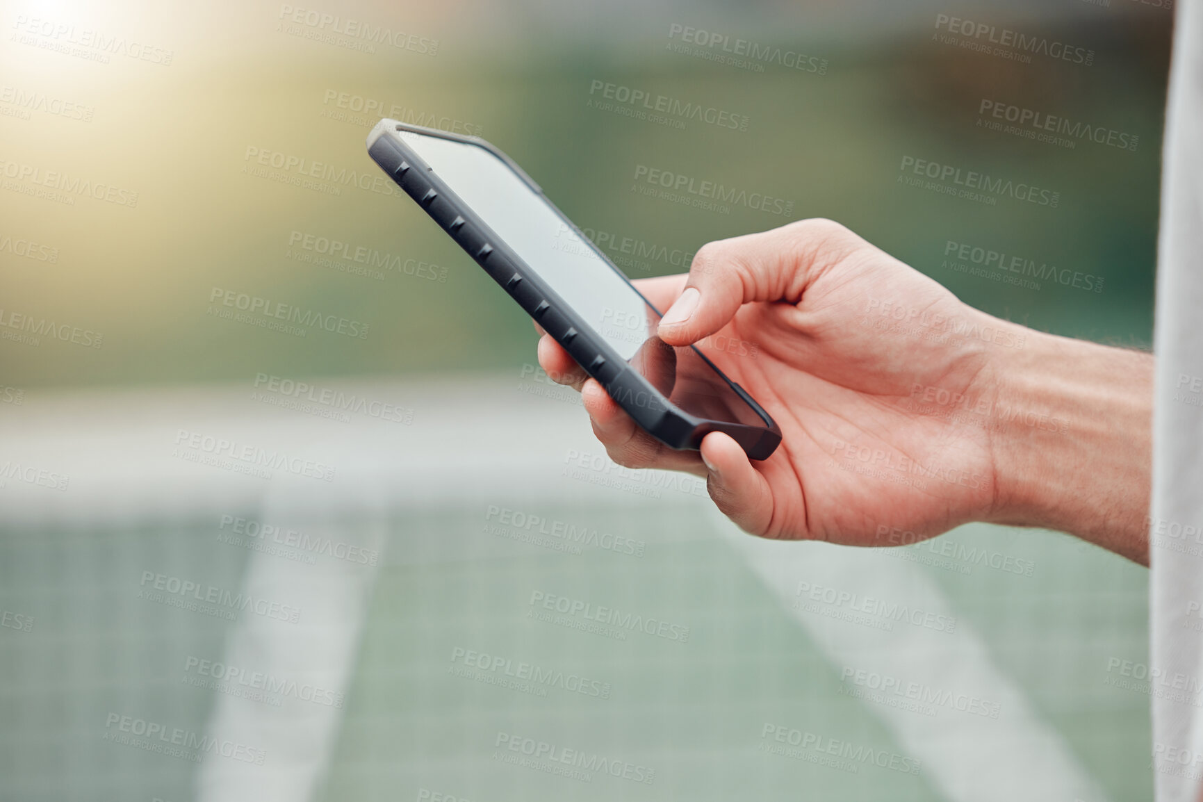 Buy stock photo Man, hands and phone on tennis court for social media, communication or networking outdoors. Closeup hand of man typing, texting or chatting on mobile smartphone, screen or display with mockup space
