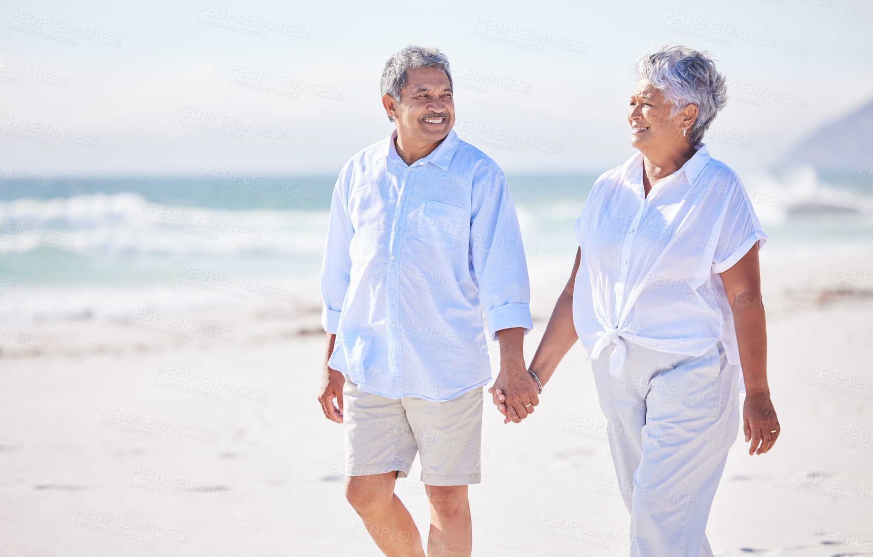 Buy stock photo Holding hands, beach or happy old couple walking in summer with happiness, trust or romance. Lovers, smile or senior man enjoying bonding time with mature woman taking a walk on sand at sea or ocean