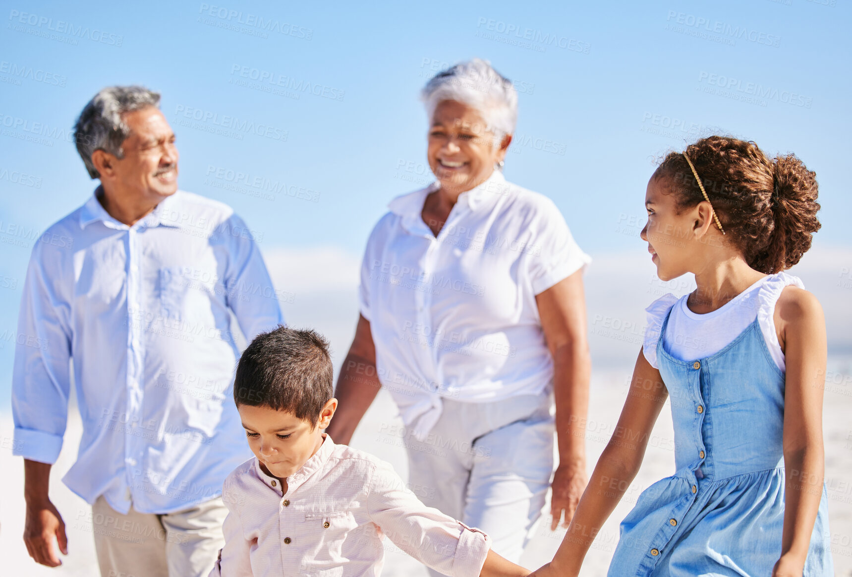 Buy stock photo Beach, grandparents or happy kids holding hands, walking or smiling in summer as a family in nature. Grandmother, senior grandfather or young children siblings bonding or taking walk together at sea