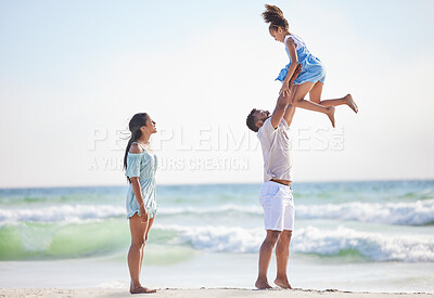 Buy stock photo Mother, beach or father playing a girl in air on a family holiday, vacation or weekend break together. Parents, mom or dad swinging or bonding with child, daughter or kid at seaside with happiness 