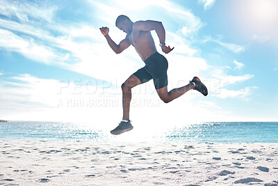 Buy stock photo Fitness, runner and jump of black man at beach for cardio workout, training and wellness body. Summer, run and focus of strong athlete running and jumping on sand at ocean in Los Angeles, USA.

