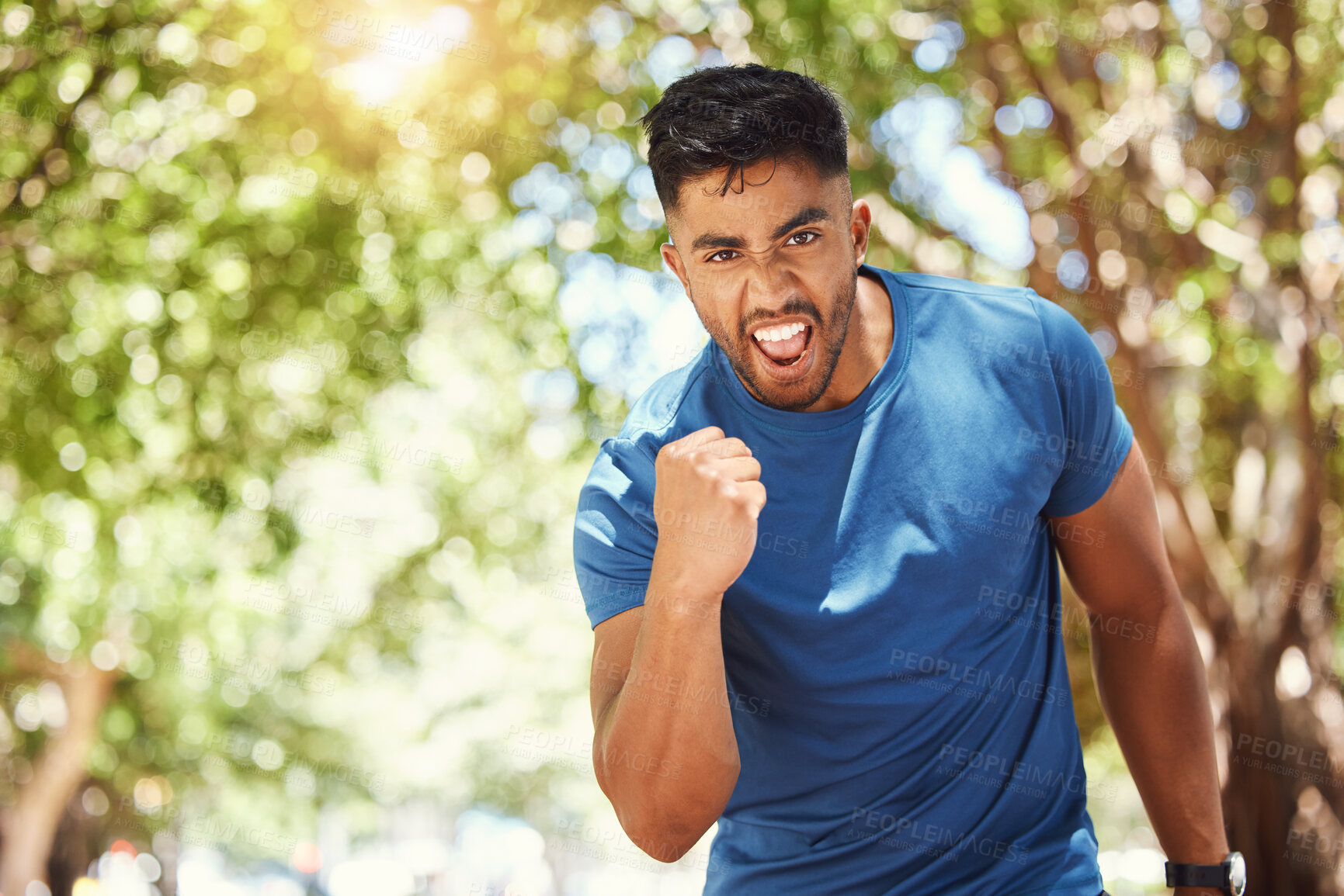 Buy stock photo Running, portrait and a man celebrate outdoor for exercise, training or fitness goals. Excited Indian male athlete with a fist in nature for a workout, run and performance target, success or win