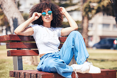 Buy stock photo Fashion, bench and woman with sunglasses, portrait and summer with stylish clothes, trendy and gen z. Face, happy female person and girl outdoor, eyewear and casual outfit with beauty, edgy and relax