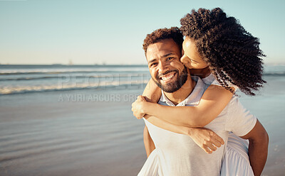 Buy stock photo Kiss, piggyback and portrait of couple at beach for summer holiday, vacation and romantic date. Love, dating and happy mixed race man and woman kissing for bonding, relaxing and honeymoon by sea
