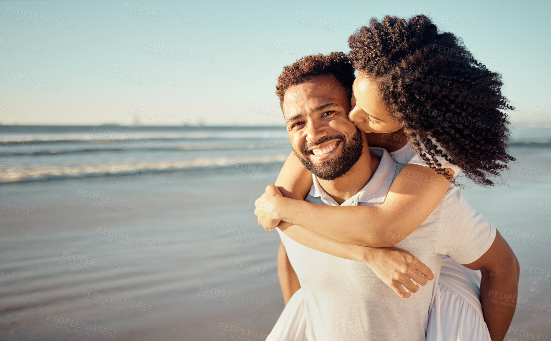 Buy stock photo Kiss, piggyback and portrait of couple at beach for summer holiday, vacation and romantic date. Love, dating and happy mixed race man and woman kissing for bonding, relaxing and honeymoon by sea