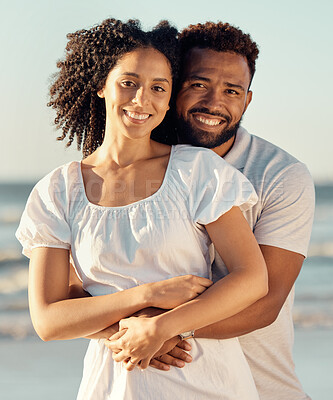 Buy stock photo Hug, happy and portrait of couple at beach for summer holiday, vacation and romantic date in nature. Love, dating and mixed race man and woman hugging for bonding, relax and honeymoon by sea together