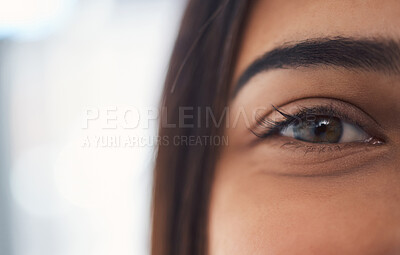 Closeup portrait of a mixed race unrecognizable woman eye with perfect eyebrows and natural looking eyelash extensions while at home on the weekend