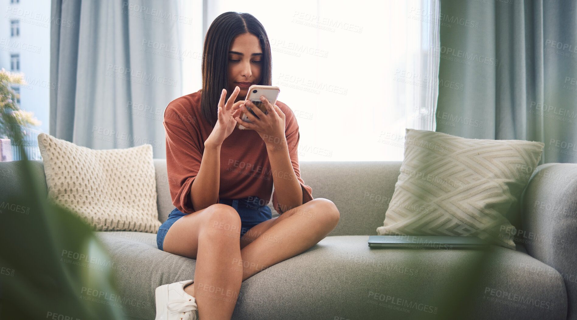 Buy stock photo Woman, scroll and phone for social media in home, typing and surfing on dating app for love search. Female person, communication and website for online shopping, reading ebook and relax in lounge