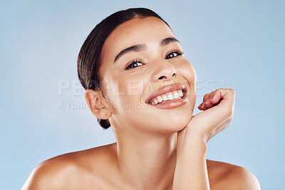 Buy stock photo Portrait, skincare and woman with cosmetics, smile and dermatology against blue studio background. Face, female person or model with salon treatment, luxury and grooming with foundation and aesthetic