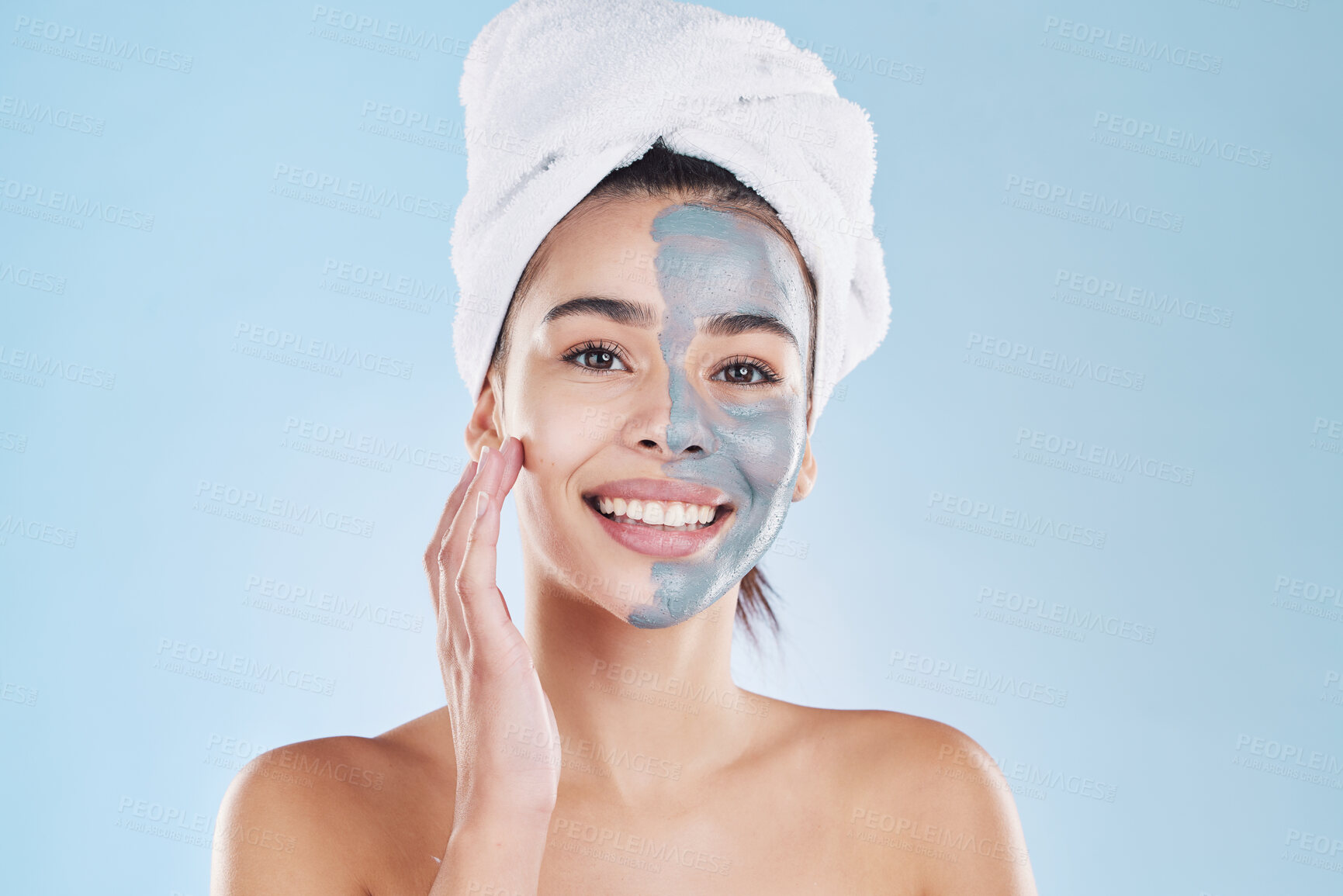 Buy stock photo Beauty, skincare product and face mask with a portrait of a beautiful woman taking care of her clean, healthy and happy skin. Smile, charcoal or clay exfoliate during routine hygiene treatment
