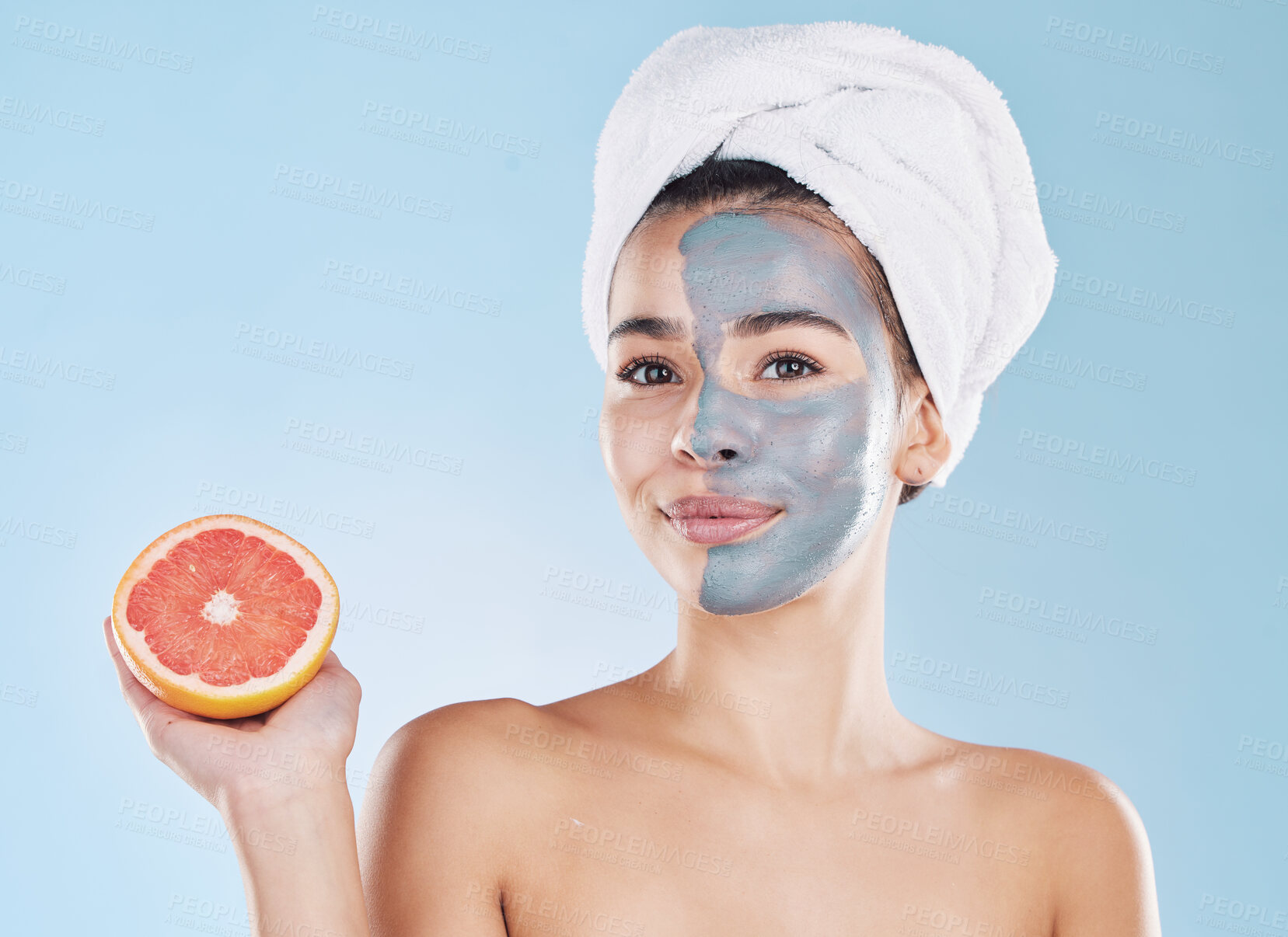 Buy stock photo Woman, skincare and grapefruit face mask, organic beauty and wellness for healthy antiaging, fresh detox and natural clean facial on blue background. Portrait, feminine grooming and model bodycare