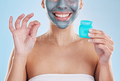 Buy stock photo Teeth, skin and morning self care woman with flossing product, face mask and cleaning teeth for hygiene, wellness and body health. Model with bathroom skincare routine, blue studio background mockup