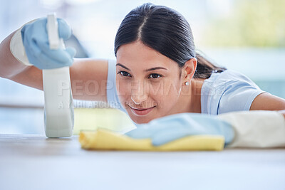 Buy stock photo Woman, housekeeper and detergent for cleaning table, hygiene or bacteria and germ removal at home. Female person, cleaner or maid spraying and wiping furniture or surface for dust, dirt or stain