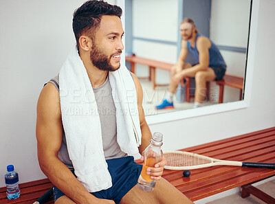 Buy stock photo Young player drinking water while talking to his friend. Two friends bonding after a squash match. Two men sitting in a gym locker room after a match. Confident friends being social at the gym