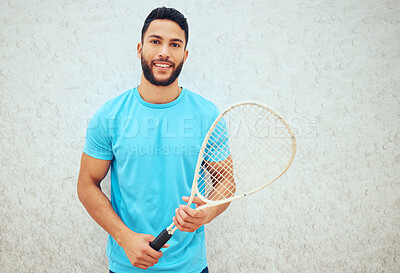 Buy stock photo Portrait of squash player smiling and holding racket before playing court game with copyspace. Happy fit active hispanic athlete standing alone and getting ready for training practice in sports centre