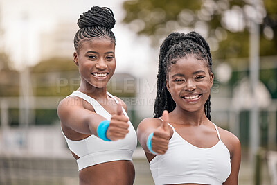 Buy stock photo Portrait of african american tennis players with a thumbs up. Happy friends support each other before tennis practice. Young tennis players celebrate their success after a match