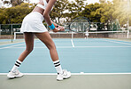 Professional tennis player waiting for a game of tennis. African american woman waiting to serve in a match of tennis. Woman competing in a tennis match with a friend. Two friends playing tennis