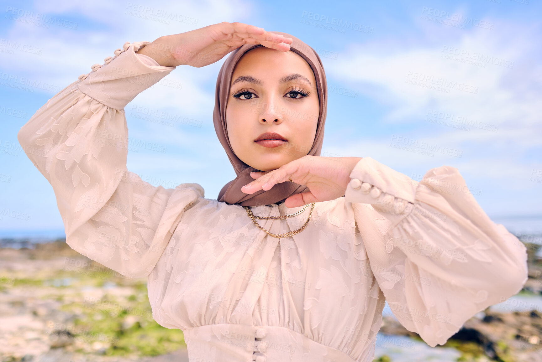 Buy stock photo Portrait, hands or fashion with an islam woman outdoor in a hijab for religion or contemporary style. Islam, faith or headscarf with a trendy young arab female person posing outside in modern clothes