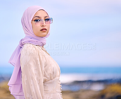 Buy stock photo Portrait, fashion or sunglases with a muslim woman on mockup outdoor in a scarf for contemporary style. Islam, faith and hijab with an edgy young arab female person posing outside in modern eyewear